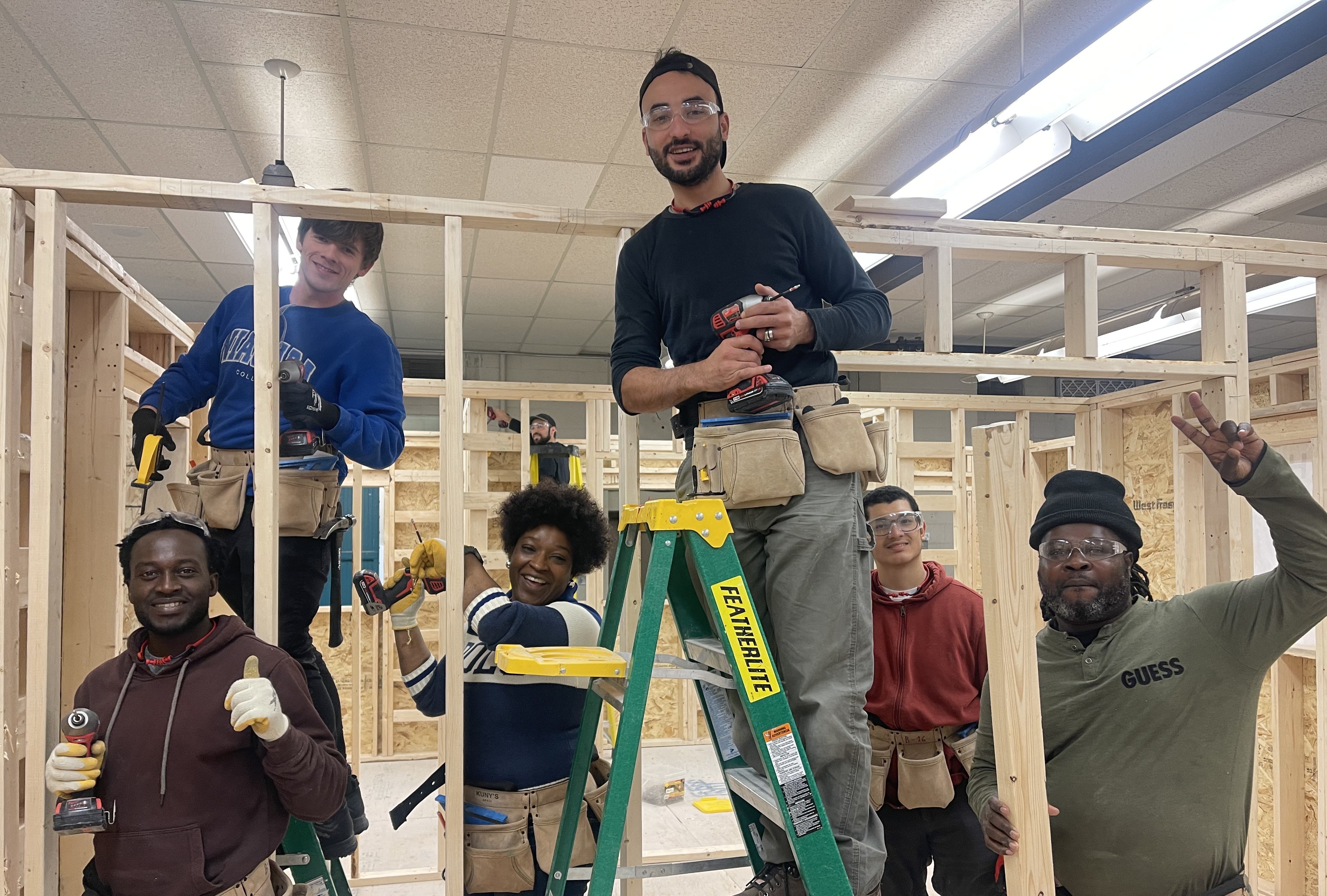 Power of Trades program team reviewing training materials